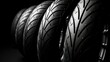 Car tires arranged in rows in front of black background