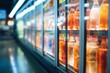 Blurry abstract backdrop of supermarket coolers filled with soft drink bottles