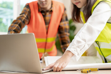 Wall Mural - Engineers team and owner discuss check and review the blueprint of construction. Contractor inspection drawing before start project civil. project planning, consulting, architecture.