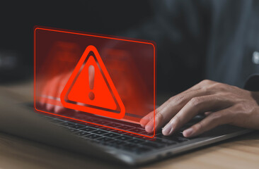 Wall Mural - laptop shows a warning sign of system failure and notification spam