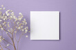 Square paper card mockup with copy space, top view with botanical decor on lavender color background