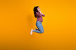 © deagreez - Full size photo of impressed woman with wavy hairdo dressed checkered shirt hands on cheeks look empty space isolated on yellow background