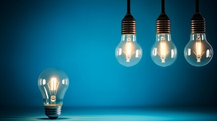 Light bulbs and energy saver bulb on blue background