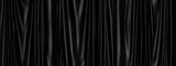 Fototapeta  - Seamless black theater curtains background. Luxurious silky velvet tileable drapes texture. Repeat pattern for performance, promotion backdrop