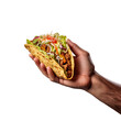 © PixelXpert - Hand holding traditional Mexican taco with meat ball isolated on transparent background.
