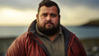 © basketman23 - Portrait of a Plus-size 30-year-old man on the shore,  looking at the viewer