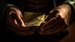 Hands of a man reaching into his open wallet to retrieve a specific card, depicting a moment of financial decision-making. 