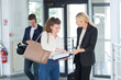 © auremar - business people talking in corridor
