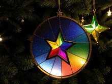  A Stained Glass Star Ornament Hanging From A Christmas Tree.  Generative Ai