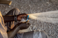 Fisherman Mending Nets In Fadiouth, Senegal