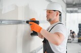 Fototapeta  - Worker install a plasterboard wall