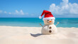© Giotto - Christmas holidays on a sunny beach: sand snowman with Santa hat