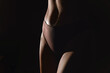 © stanislav - Cropped image of female body, muscular belly, leg. Model standing in underwear. Studio background. Concept of natural beauty, body and skin care, health, sport