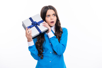 Sticker - Child with gift present box on isolated white background. Presents for birthday, Valentines day, New Year or Christmas. Surprised emotions of young teenager girl.