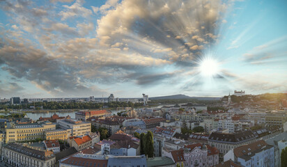 Wall Mural - Bratislava, Slovakia. Aerial view of city center at sunset. Panoramic viewpoint from drone