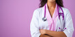Young female doctor in a white coat, stethoscope and purple background. Cancer support, health and medicine. Copy space.
