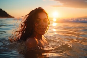 Wall Mural - Young cheerful woman bathing in warm tropical sea