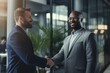 © blvdone - Businessmen shaking hands at office