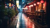 Fototapeta Uliczki - A peaceful and lovely evening setting in Japan following rain in the rural or small-town landscape, adorned with the gentle glow of lights and reflections on the streets