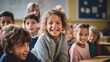 © olegganko - A Joyous Scene: Smiling Children and Teacher in a Classroom