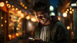 young man holding a smartphone with a glowing light in the city
