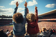 © Degimages - A group of children on stadium with their hands in the air supporting the team players.