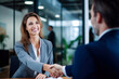 © Danny - Smiling middle aged businesswoman handshaking partner making partnership collaboration agreement at office meeting.