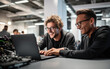 © piai - Friends programmers is looking at the laptop with codes, seems happy