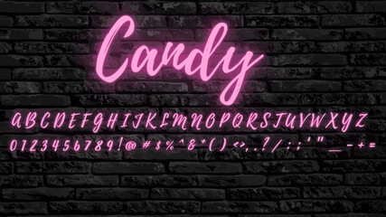 Neon Pink script font saying candy and brick background script font. Glowing Pink alphabet with letters, numbers and special characters.