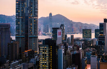 Aerial Scenery Panoramic View Of Hong Kong Evening With Metropolitan Bay Victoria Harbor At Sunset.