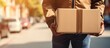 Delivery service for ecommerce or cargo shipping involving boxes hands couriers and mail Logistics and individuals responsible for closeup package handling stock and front door freight for w