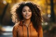 © Алина Бузунова - Young african american woman running outdoor at autumn. Activities for happy fall.