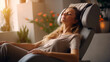 Woman relaxing on electric massage chair in living room.