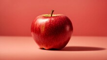 AI Generated Illustration Of A Ripe Red Apple On A Red Background
