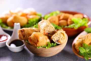 Poster - asian food assortment- fried spring roll, fried shrimp,samosa and soy sauce