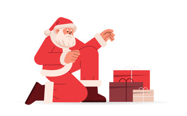 Poster - santa claus in red costume sitting on floor near gift boxes happy new year merry christmas holidays celebration concept