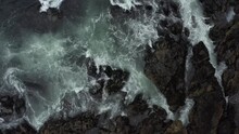 Strong Sea Waves Breaking On Rugged Shoreline. Aerial Drone Shot