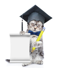 Poster - Happy graduated cat wearing eyeglasses and tie bow standing on hind legs and shows empty list. isolated on white background