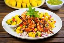 Grilled King Prawns With Mango Salsa On A Plate