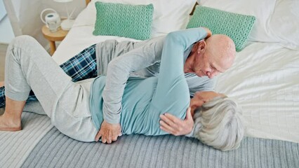 Poster - Love, happy and senior couple on bed with romance, bonding and relaxing together at home. Smile, kissing and elderly man and woman in retirement laying in bedroom of modern house or apartment.