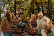 © bernardbodo - Whole happy family having a picnic in the forest
