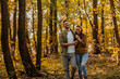 © bernardbodo - Happy couple hugging and walking in the forest