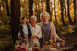 © bernardbodo - Family having a picnic in the forest on fall