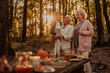 © bernardbodo - Family having a picnic in the forest on fall