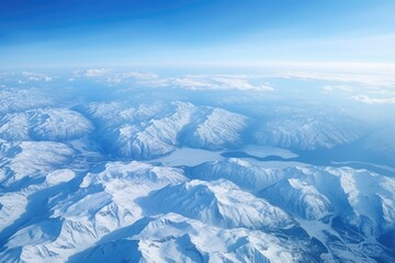 Wall Mural - an aerial view of a snow-covered mountain range