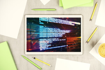 Wall Mural - top view of modern digital tablet monitor with abstract programming language hologram, artificial in