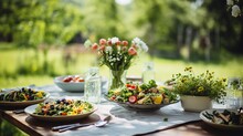 A Garden Party Table With Fresh Salads And Herbs