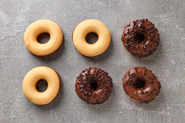 Wall Mural - Chocolate donuts on gray background, top view