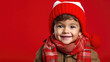© Peter - Little cute boy in Red Christmas Outfit with Candy: A blend of seasonal joy and sweet delight | Isolated with empty space for copy.