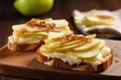 pear slices layered on toasted bread with cheese